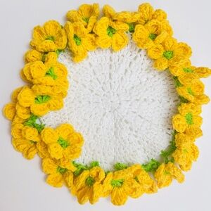 Handmade-knitted coasters With Yellow Flowers and white handmade-knitted basket